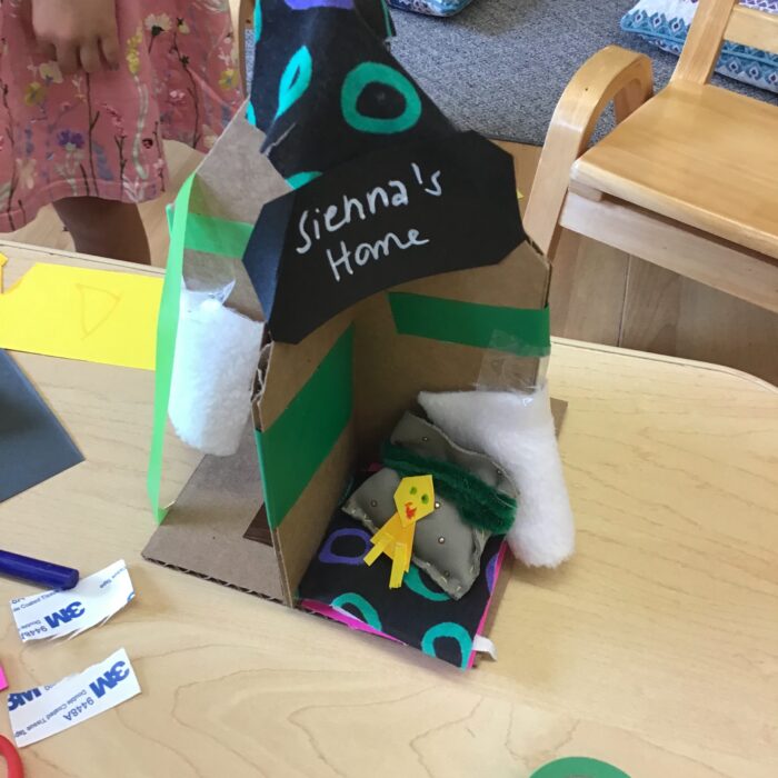 House creation with a little character lying in bed
